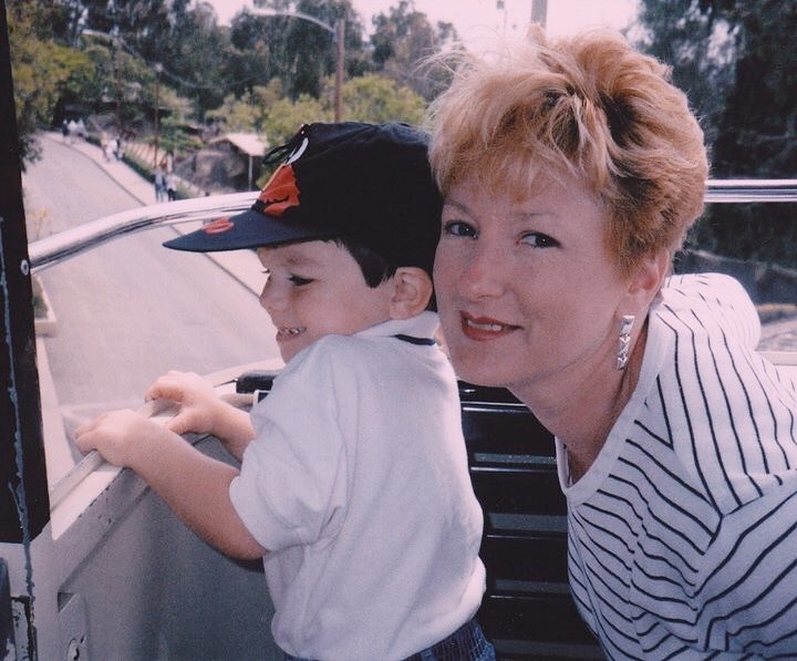 A baby Dylan Mulvaney with her mother